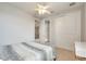 Bedroom featuring a ceiling fan and closet at 11885 Padua Ln, Orlando, FL 32827