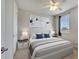 Serene bedroom with a comfortable bed, stylish artwork, and soft, natural light at 11885 Padua Ln, Orlando, FL 32827