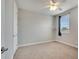 Well-lit bedroom features neutral tones and plush carpet at 11885 Padua Ln, Orlando, FL 32827