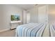 Bedroom features a flat-screen tv, natural light and neutral tones at 11885 Padua Ln, Orlando, FL 32827
