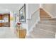 Entryway features stairway and access to the kitchen at 11885 Padua Ln, Orlando, FL 32827