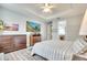 Light and bright main bedroom with modern decor and en-suite bathroom access at 11885 Padua Ln, Orlando, FL 32827