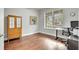 Bright and airy office space featuring hardwood floors, natural light, and modern desk setup at 11885 Padua Ln, Orlando, FL 32827