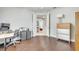 Spacious office featuring hardwood floors and open doorway to entryway at 11885 Padua Ln, Orlando, FL 32827