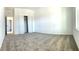Carpeted bedroom with a closet and a view of the doorway leading to an ensuite bathroom at 1374 Brentwood Dr, Kissimmee, FL 34746