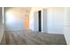 This bedroom features neutral carpet and a closet with bi-fold doors at 1374 Brentwood Dr, Kissimmee, FL 34746