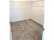 A walk-in closet with wire shelving and neutral carpet at 1374 Brentwood Dr, Kissimmee, FL 34746