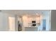 Spacious kitchen featuring an island with stainless steel appliances and ample white cabinetry at 1374 Brentwood Dr, Kissimmee, FL 34746