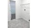 Laundry room features tile floor, wire shelving, and washer/dryer hookups at 1374 Brentwood Dr, Kissimmee, FL 34746