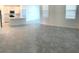 Open-concept living room and kitchen area with tile flooring and ample natural light at 1374 Brentwood Dr, Kissimmee, FL 34746