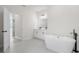 Bathroom features a soaking tub, double vanity and black fixtures at 14961 Sw 38Th Cir, Ocala, FL 34473