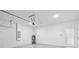 Spacious garage featuring white brick walls and an access door at 14961 Sw 38Th Cir, Ocala, FL 34473