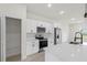 Kitchen with pantry features white cabinets, stainless steel appliances and quartz countertops at 14961 Sw 38Th Cir, Ocala, FL 34473