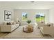 Cozy living room featuring neutral tones, comfortable seating, and sliding glass doors to backyard at 14961 Sw 38Th Cir, Ocala, FL 34473