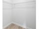 Walk-in closet with wire shelving and laminate flooring at 14961 Sw 38Th Cir, Ocala, FL 34473