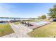 Lakeside community area featuring bocce court, benches, and docks, creating a relaxing recreational space at 151 N Orlando Ave # 115, Winter Park, FL 32789