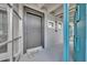 Inviting condo entrance featuring a gray door, stylish hardware, and a charming welcome mat at 151 N Orlando Ave # 115, Winter Park, FL 32789