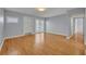 Open living area with hardwood floors, sliding doors for natural light and easy access to outdoor space at 151 N Orlando Ave # 115, Winter Park, FL 32789