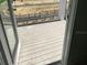 View of the back porch featuring a wooden floor and a metal safety railing overlooking the road at 15483 Hamlin Park Drive, Winter Garden, FL 34787