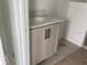 New bathroom with a single sink vanity with a gray cabinet and white countertop at 15483 Hamlin Park Drive, Winter Garden, FL 34787