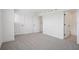 Spacious bedroom with gray carpeting, white walls, and two interior doors at 15483 Hamlin Park Drive, Winter Garden, FL 34787