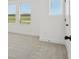 Bright bedroom with neutral carpeting and three large windows, allowing ample natural light at 15483 Hamlin Park Drive, Winter Garden, FL 34787