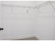 Walk-in closet featuring installed shelving and neutral carpet at 15483 Hamlin Park Drive, Winter Garden, FL 34787
