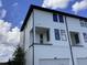 New construction two-story home with a covered porch above the garage at 15483 Hamlin Park Drive, Winter Garden, FL 34787