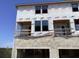Exterior of a two-story house under construction with exposed wood framing at 15483 Hamlin Park Drive, Winter Garden, FL 34787