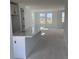A view of an open concept kitchen, dining, and living space in a new construction home at 15483 Hamlin Park Drive, Winter Garden, FL 34787