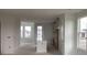 A view of an open concept kitchen, dining, and living space in a new construction home at 15483 Hamlin Park Drive, Winter Garden, FL 34787