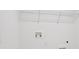 A functional laundry room with essential hookups and shelving for storage solutions at 15483 Hamlin Park Drive, Winter Garden, FL 34787