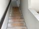Staircase under construction leading upwards with unfinished treads, risers, and white painted walls at 15483 Hamlin Park Drive, Winter Garden, FL 34787