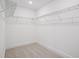 A functional walk-in closet offering ample storage space with installed wire shelving at 15483 Hamlin Park Drive, Winter Garden, FL 34787