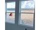 Double windows offer natural light and a view of the neighborhood beyond at 15483 Hamlin Park Drive, Winter Garden, FL 34787