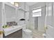 Modern bathroom featuring a glass-enclosed shower, sleek vanity, and stylish mosaic tile accents at 162 Plumoso Loop, Davenport, FL 33897