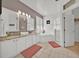 Inviting bathroom with dual sinks, garden tub and glass enclosed shower at 162 Plumoso Loop, Davenport, FL 33897