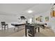 Open game room featuring a pool table, foosball table, and an air hockey table; perfect for entertaining guests at 162 Plumoso Loop, Davenport, FL 33897