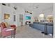 Comfortable living room with a large TV, leather sofa, and stylish decor, creating a relaxing atmosphere at 162 Plumoso Loop, Davenport, FL 33897
