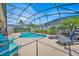Fenced pool area with ample space for lounging and dining at 162 Plumoso Loop, Davenport, FL 33897