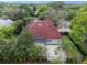 View of a tile roofed home with a screened-in lanai and a patio with a modern grid design at 1803 Glenbay Ct, Windermere, FL 34786