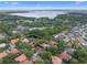 Community aerial view, lush trees and greenery surrounds beautiful homes near a serene lake at 1803 Glenbay Ct, Windermere, FL 34786