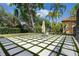 Beautiful backyard with stone pavers, lush lawn, and privacy landscaping at 1803 Glenbay Ct, Windermere, FL 34786
