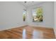Bedroom with hardwood floors and two windows offering lots of natural light at 1803 Glenbay Ct, Windermere, FL 34786
