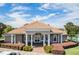 Community center featuring a beautiful tile roof, elegant columns and well-maintained landscaping at 1803 Glenbay Ct, Windermere, FL 34786