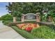 Elegant community entrance sign with manicured landscaping and brick pillars at 1803 Glenbay Ct, Windermere, FL 34786