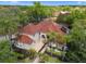 Stunning home featuring a red tile roof, manicured landscaping and a welcoming front entrance at 1803 Glenbay Ct, Windermere, FL 34786
