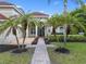 Charming home featuring a tile roof, lush landscaping, and a brick walkway at 1803 Glenbay Ct, Windermere, FL 34786