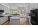 Contemporary kitchen with island, stainless appliances, double oven, and lots of counter space at 1803 Glenbay Ct, Windermere, FL 34786