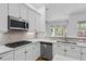 Modern kitchen with stainless appliances, custom cabinetry, and quartz countertops at 1803 Glenbay Ct, Windermere, FL 34786